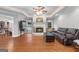 Bright living room featuring a fireplace, hardwood floors, and natural light at 605 Clearwater Ct, Mcdonough, GA 30252