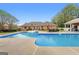 Backyard pool offers a relaxing escape with ample seating areas and well-maintained grounds at 605 Clearwater Ct, Mcdonough, GA 30252