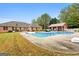 Backyard pool with a large in-ground pool with an adjacent pool house creating a resort-like experience at 605 Clearwater Ct, Mcdonough, GA 30252