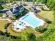 A gorgeous view of a community pool with a splash area and lounge chairs at 6690 Bridge Brook Ovlk, Cumming, GA 30028