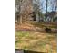 Large backyard featuring a stone retaining wall and swing set at 1121 Valley Ridge, Marietta, GA 30067