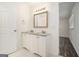 Bathroom featuring double vanity with granite countertops and white cabinets at 5595 Richland Dr, Douglasville, GA 30135