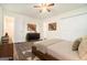 Neutral bedroom featuring wood-look floors, natural light, and closet storage at 5595 Richland Dr, Douglasville, GA 30135