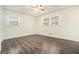 Spacious empty bedroom featuring wood-look floors and great natural light at 5595 Richland Dr, Douglasville, GA 30135