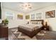 Staged bedroom featuring modern decor, stylish rug, and plenty of natural light at 5595 Richland Dr, Douglasville, GA 30135