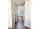 Hallway showing hardwood floors leading into the house at 5625 Jamerson Dr, South Fulton, GA 30349