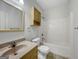 Full bathroom showcasing a wooden vanity with a single sink and shower at 10067 Freeman Ct, Jonesboro, GA 30236