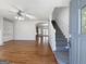 Bright foyer with hardwood floors featuring stairs to the second floor and an open floor plan at 10067 Freeman Ct, Jonesboro, GA 30236