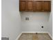 Convenient laundry room hookups, ready for appliances, featuring neutral tile flooring and ample space at 10067 Freeman Ct, Jonesboro, GA 30236