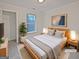 Cozy staged bedroom with a plush rug, a serene ambiance, and natural light at 483 Fairlane Nw Cir, Atlanta, GA 30331