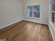 Bright bedroom with hardwood floor, natural light, and a large window at 483 Fairlane Nw Cir, Atlanta, GA 30331