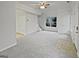 Spacious living room with neutral walls, carpet, and natural light at 483 Fairlane Nw Cir, Atlanta, GA 30331