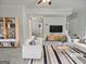 Bright living room with neutral walls, plush carpet, and modern decor at 483 Fairlane Nw Cir, Atlanta, GA 30331