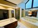 Bathroom featuring double vanity, soaking tub and glass enclosed shower at 105 Windridge Dr, Fayetteville, GA 30215