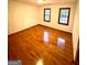 Bright bedroom featuring hardwood floors and two windows at 105 Windridge Dr, Fayetteville, GA 30215