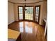 Sun-drenched breakfast nook with large bay window and gleaming hardwood floors at 105 Windridge Dr, Fayetteville, GA 30215