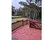 Spacious wooden deck overlooks a large backyard, perfect for outdoor entertaining at 105 Windridge Dr, Fayetteville, GA 30215