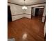 Dining room with hardwood floors and traditional chandelier, perfect for gatherings at 105 Windridge Dr, Fayetteville, GA 30215
