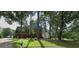 Charming two-story home with well-maintained lawn, mature trees, and a brick facade at 105 Windridge Dr, Fayetteville, GA 30215
