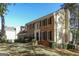 Charming brick home with black shutters and a well maintained lawn, under a bright blue sky at 105 Windridge Dr, Fayetteville, GA 30215