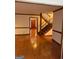 Well-lit foyer featuring hardwood floors and a staircase at 105 Windridge Dr, Fayetteville, GA 30215
