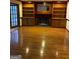 Spacious living room with a cozy fireplace, built-in shelves, and access to outdoor space at 105 Windridge Dr, Fayetteville, GA 30215