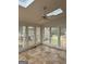 Cozy sunroom with ample windows and tile flooring at 105 Windridge Dr, Fayetteville, GA 30215