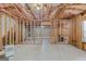 Unfinished basement featuring exposed framing offering a blank canvas for customization and future expansion at 1500 Royce Dr, Locust Grove, GA 30248