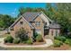 Charming brick home with well-manicured landscaping, a welcoming entrance, and a beautifully designed facade at 1500 Royce Dr, Locust Grove, GA 30248