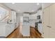 Bright kitchen with stainless steel appliances, white cabinetry, and a convenient center island at 1500 Royce Dr, Locust Grove, GA 30248