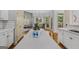 Open kitchen island with white countertops offering ample space for food preparation and casual dining at 1500 Royce Dr, Locust Grove, GA 30248