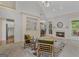 Comfortable living room featuring a fireplace, open access to other rooms and two arm chairs at 1500 Royce Dr, Locust Grove, GA 30248