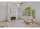 Inviting living room with a fireplace, large windows, and comfortable seating area at 1500 Royce Dr, Locust Grove, GA 30248