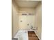 Bright laundry room with built-in shelving and hookups, perfect for easy chore days at 187 London Dr, Mcdonough, GA 30253