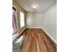 Cozy sun room with wood floors and natural light offers a peaceful retreat at 187 London Dr, Mcdonough, GA 30253