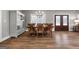 Traditional dining room features a wooden table and chairs set, chandelier lighting, and wood flooring at 1185 Old Greenville Rd, Fayetteville, GA 30215