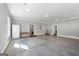 Spacious garage with concrete floor, white walls, ample lighting, and space for storage at 1185 Old Greenville Rd, Fayetteville, GA 30215