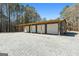 Large detached garage with multiple bays and plenty of parking at 1185 Old Greenville Rd, Fayetteville, GA 30215