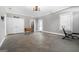 Large garage with laundry area, natural light and concrete floor provides ample space for projects at 1185 Old Greenville Rd, Fayetteville, GA 30215