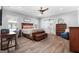 Comfortable main bedroom with wood floors, natural light, and a modern ceiling fan at 1185 Old Greenville Rd, Fayetteville, GA 30215