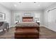 Bright main bedroom with wood floors, large windows, and a wooden bench at 1185 Old Greenville Rd, Fayetteville, GA 30215