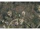 Aerial view of the neighborhood highlighting the property's location and mature tree cover at 135 Flat Creek Ct, Fayetteville, GA 30214