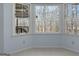 Dining area with large bay window overlooking the wooded backyard at 135 Flat Creek Ct, Fayetteville, GA 30214