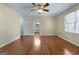 Bedroom featuring hardwood floors, natural light, and an ensuite bathroom at 135 Flat Creek Ct, Fayetteville, GA 30214