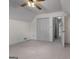 Neutral bedroom featuring a ceiling fan, light gray walls, and carpet flooring at 135 Flat Creek Ct, Fayetteville, GA 30214