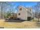 The back of the home has a covered porch and a fenced yard at 135 Flat Creek Ct, Fayetteville, GA 30214