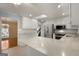 Bright kitchen featuring white cabinetry, stainless steel appliances, a skylight, and a large center island at 135 Flat Creek Ct, Fayetteville, GA 30214