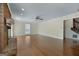 Open living room showcases hardwood floors, neutral walls, and a view of the stairs at 135 Flat Creek Ct, Fayetteville, GA 30214