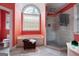 Bathroom featuring a shower, soaking tub, a large arched window, and a separate toilet area at 365 Falling Creek Bnd, Johns Creek, GA 30097