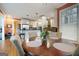 Cozy dining area showcasing a round wood table and chairs, and an open view to the kitchen at 365 Falling Creek Bnd, Johns Creek, GA 30097